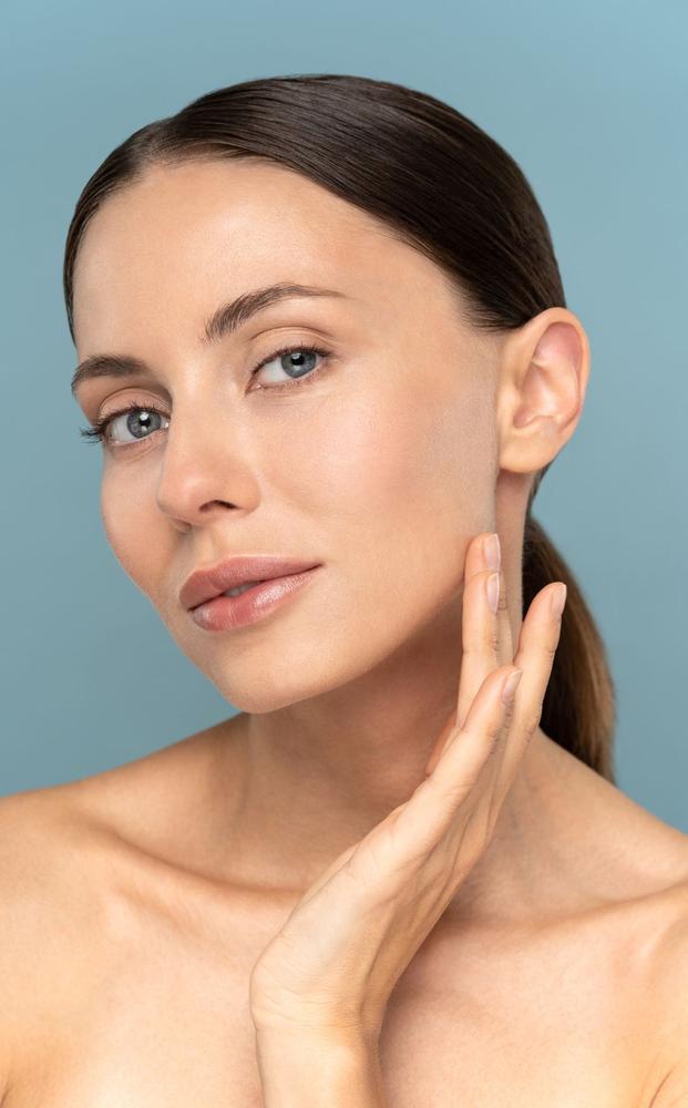 Woman receiving non-surgical rhinoplasty treatment